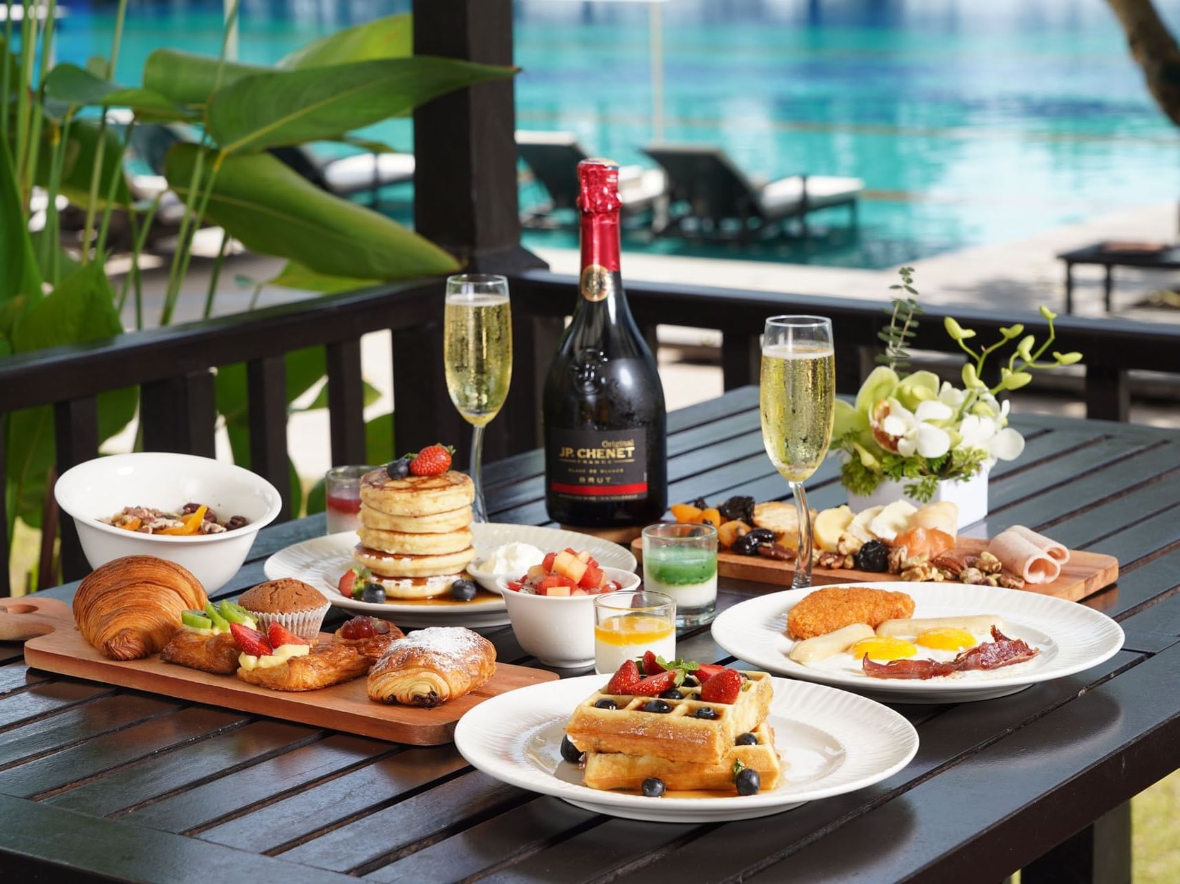 Breakfast table with food and wine at Danna Langkawi Hotel