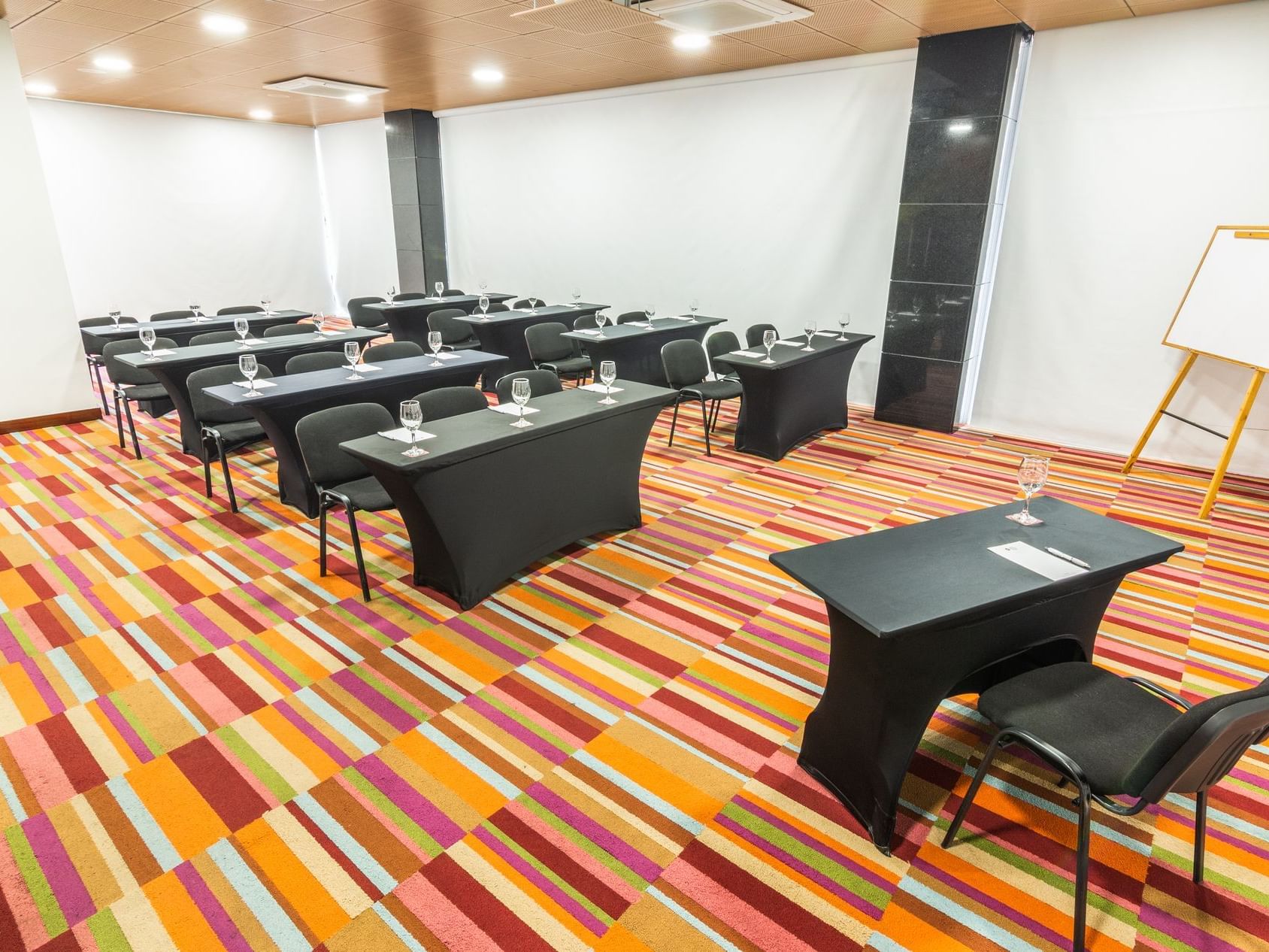 The arranged Oregon meeting room with black chairs and tables