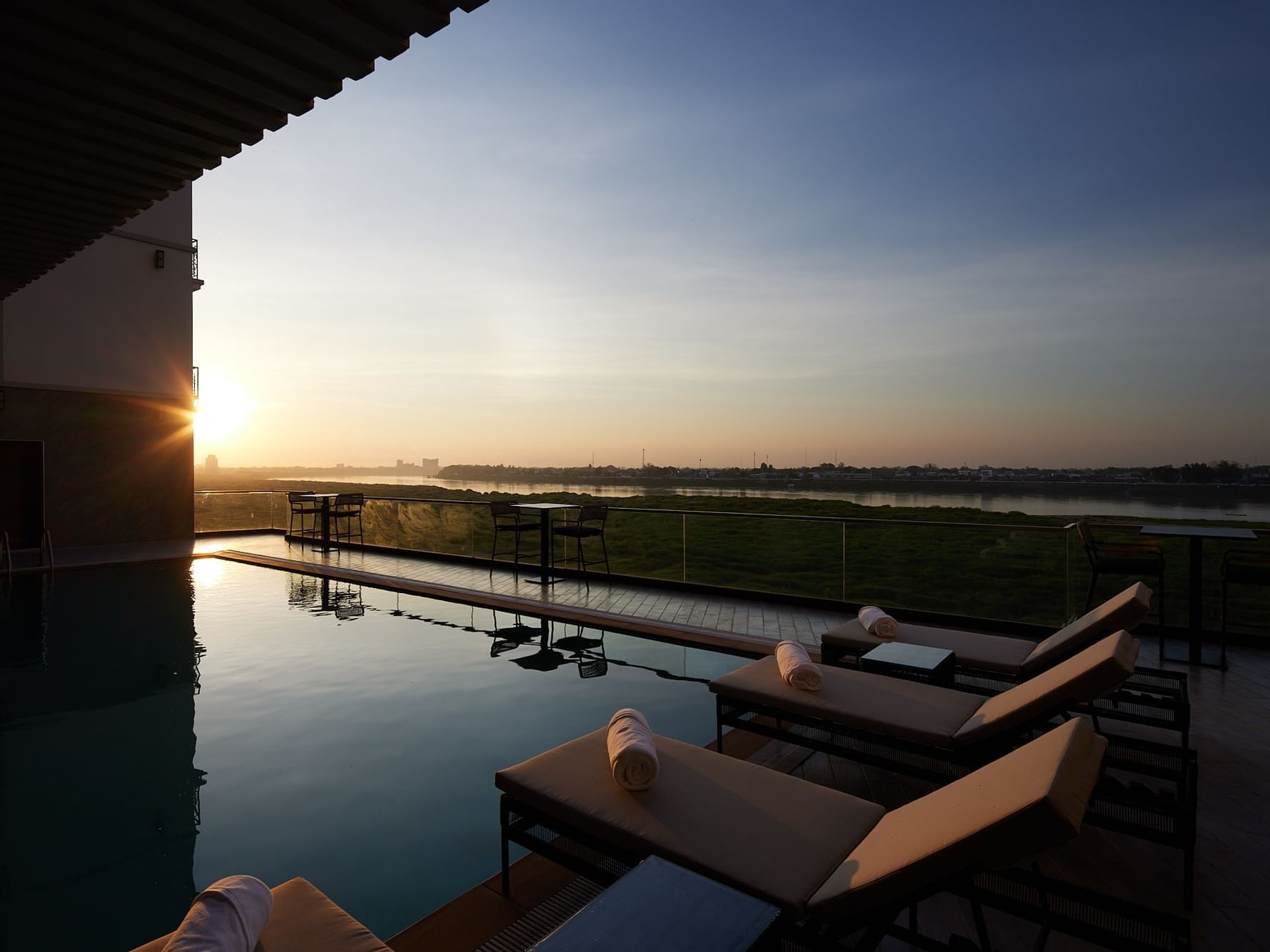 Sunset view from the rooftop pool & lounge area at Eastin Vientiane Laos