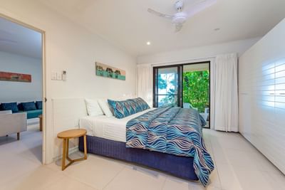 Bedroom with a king bed in Beach House at Heron Island Resort