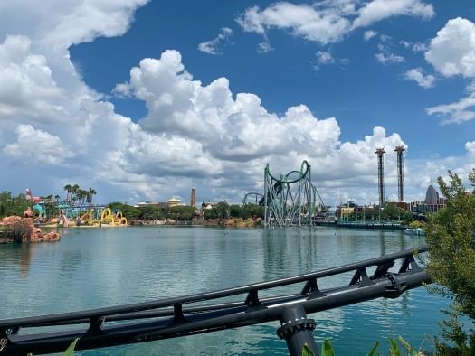 A view overlooking a body of water, with various coasters and rides in the distance. The best rides at Universal Orlando can be found here.