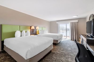 Guest room with two beds and seating at Ogunquit River Inn