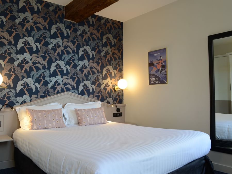 Double bed in chambre superieure at The Originals Hotels