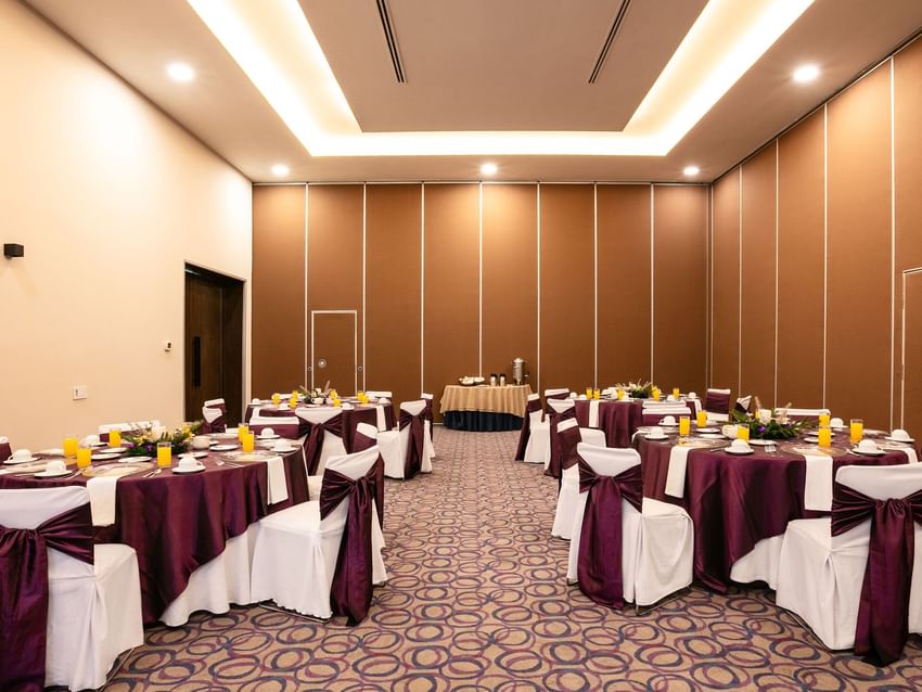 Decorated event room with tables and chairs at Camino Real Guadalajara in Zapopan