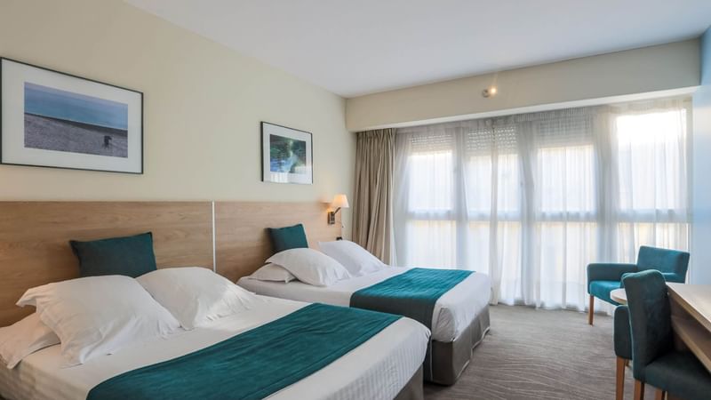 Two queen beds in Family Room at Splendid Hotel & Spa Nice