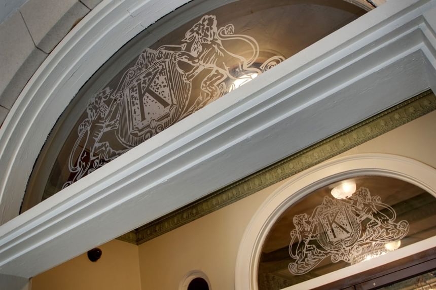 Detailed etched glass crest with the official logo at Knickerbocker On The Lake, one of the nice hotels in Milwaukee