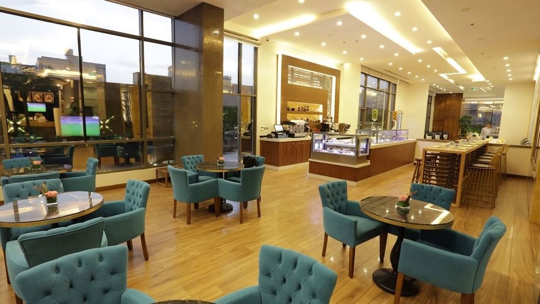 Arranged dining area by the counter in Artist at Warwick Hotel Jeddah