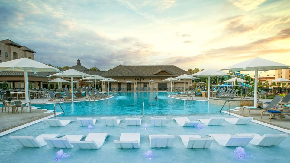 Sunbeds placed on the outdoor pool area at Shangri-La Monkey Island