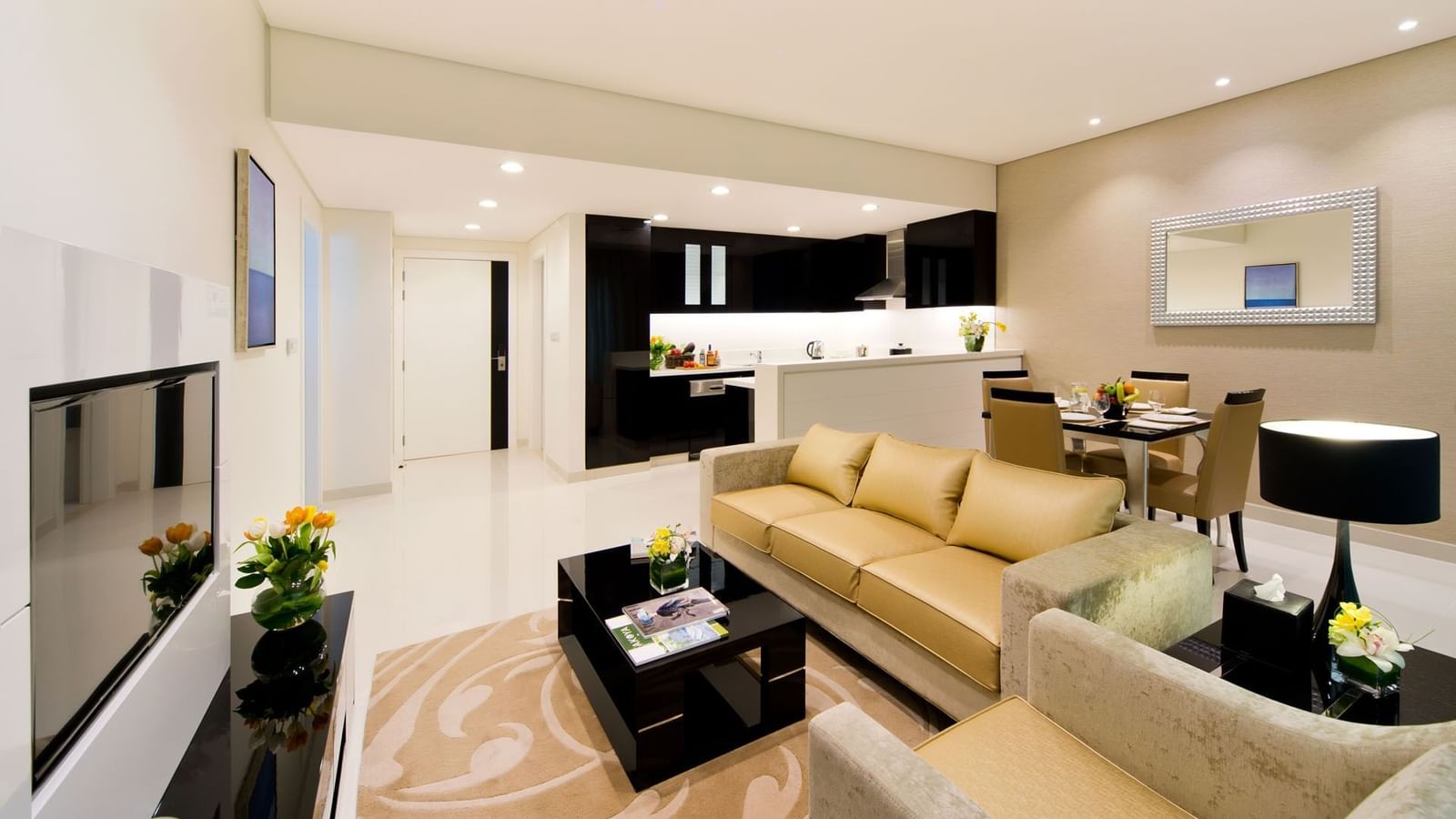 Fully equipped living room with comfy sofa in One Bedroom Suite at DAMAC Maison Canal Views