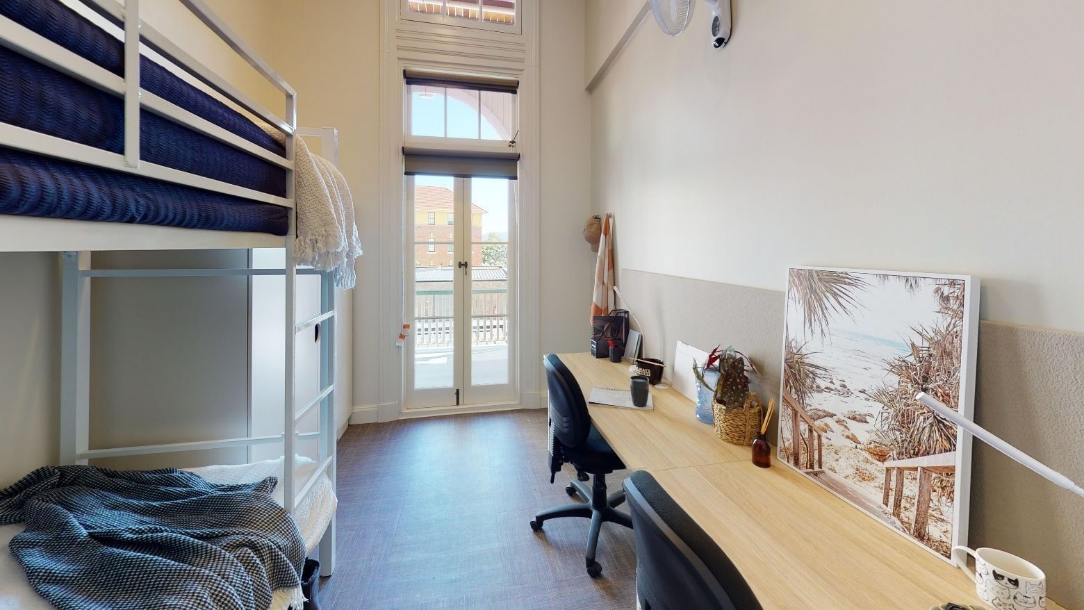 Bunk Room Twin Share with twin bunk beds, two desks and balcony at UniLodge Herston.
