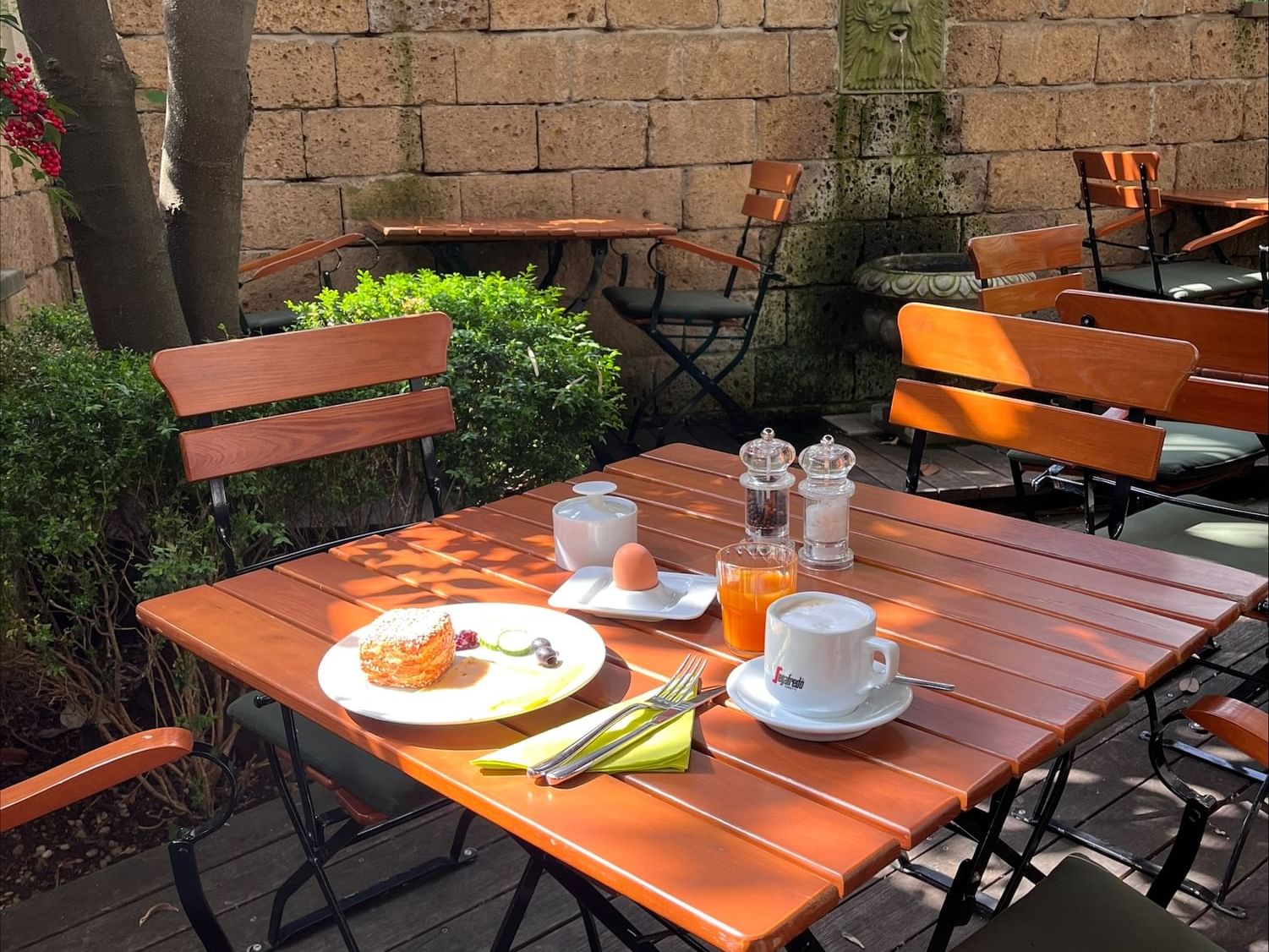 Breakfast set in outdoor dining area at Classic Hotel Harmonie