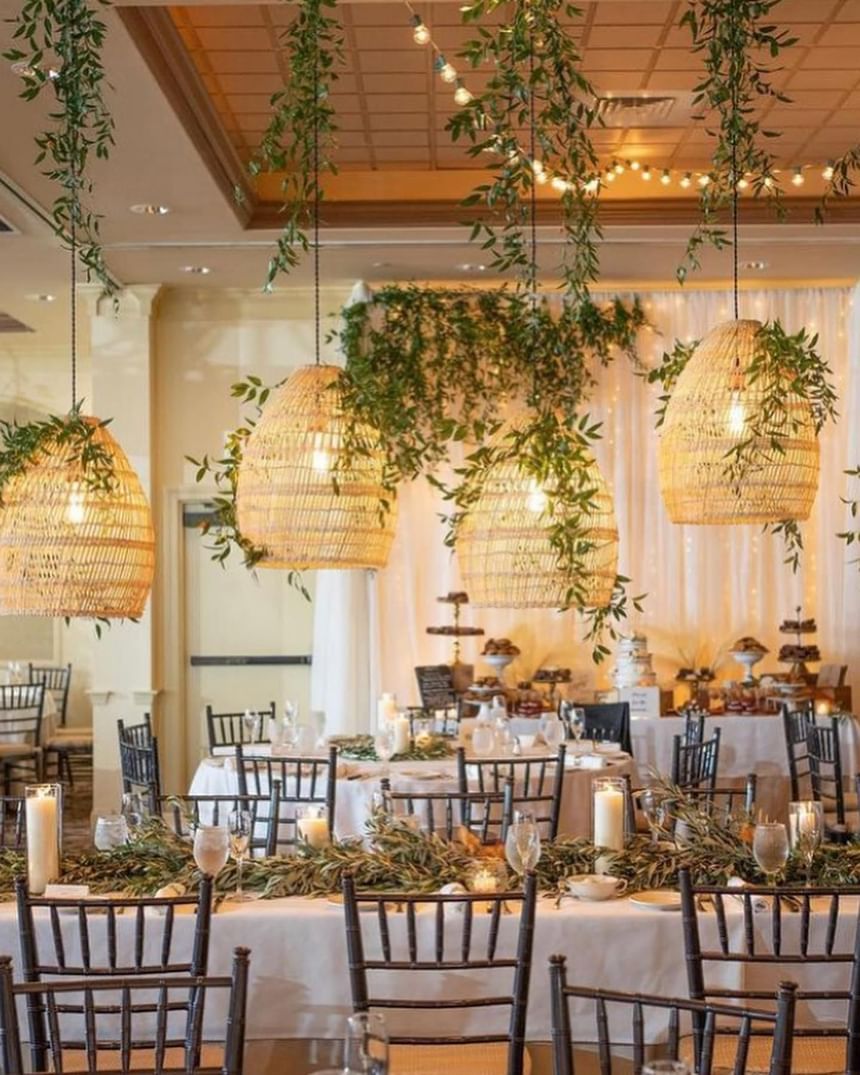 Dining area arranged with lights & flowers for a wedding at Ogunquit Collection