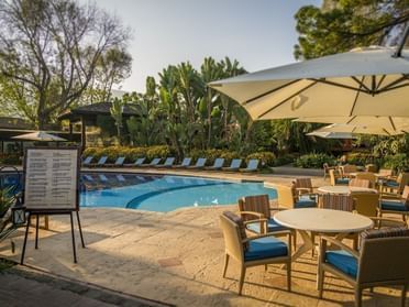 Snack Bar by the Pool surrounded by lush greenery at Porta Hotel Antigua