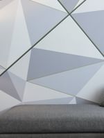Junior Balcony Suite with a sofa, nightstand, and designed wall at Warwick Le Crystal Montreal