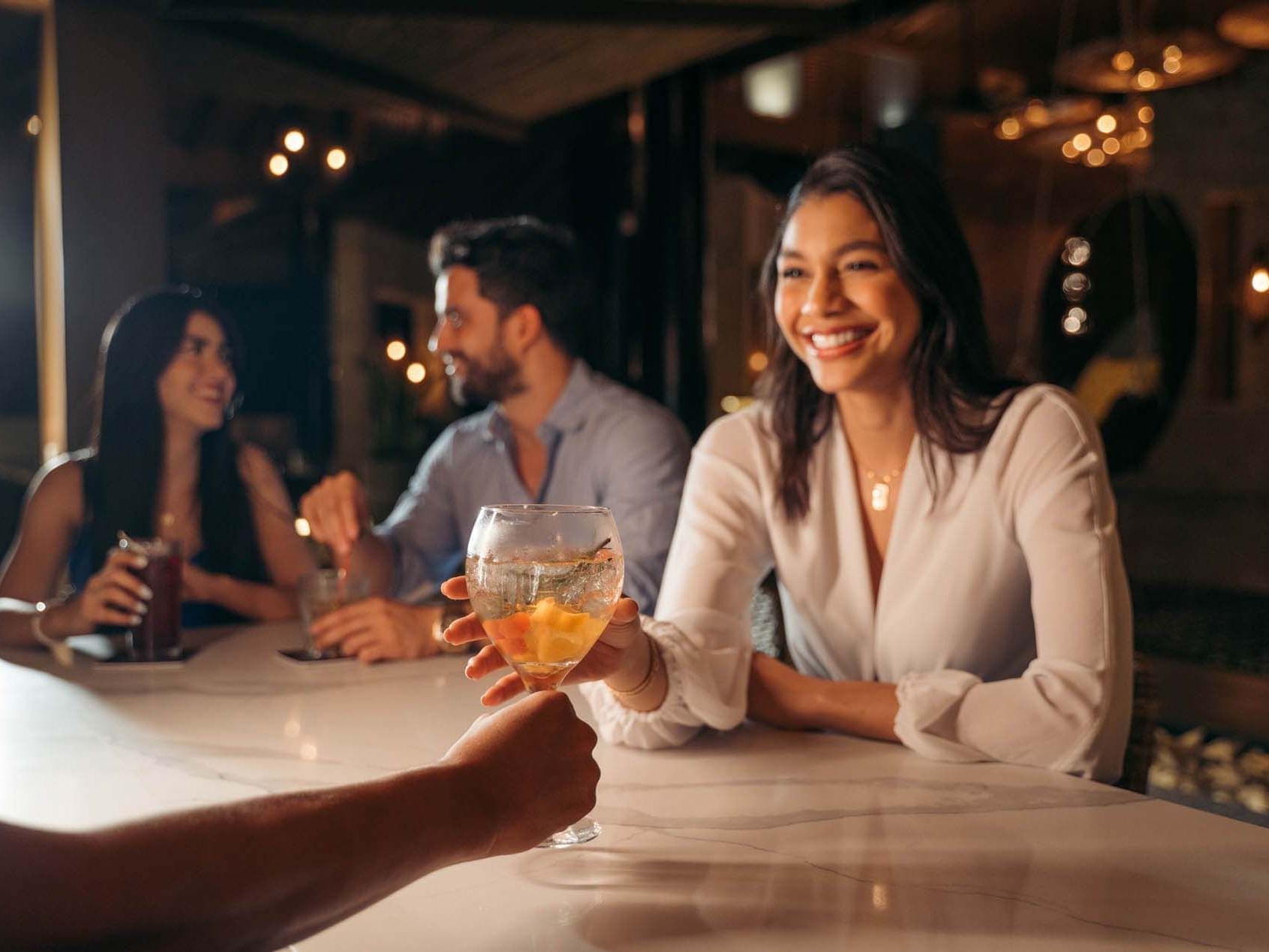 Man serving cocktails in Bahari Bar & Lounge at Indura Beach & Golf Resort