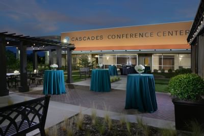 outdoor area with bar tables set for event
