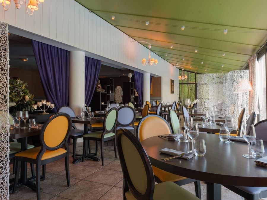 Interior of a dining area with an outside view at Hotel alteora
