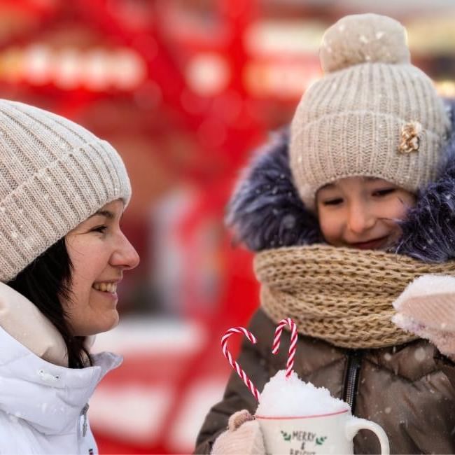 Mum and daughter enjoying hot chocolate at Wokingham Winter Carnival