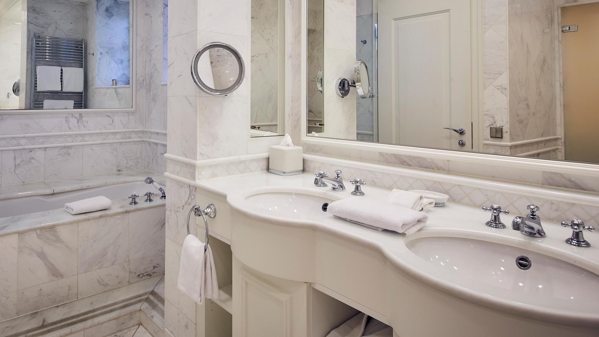 White tiled vanity area in Seeblick Suite, Falkensteiner Hotels