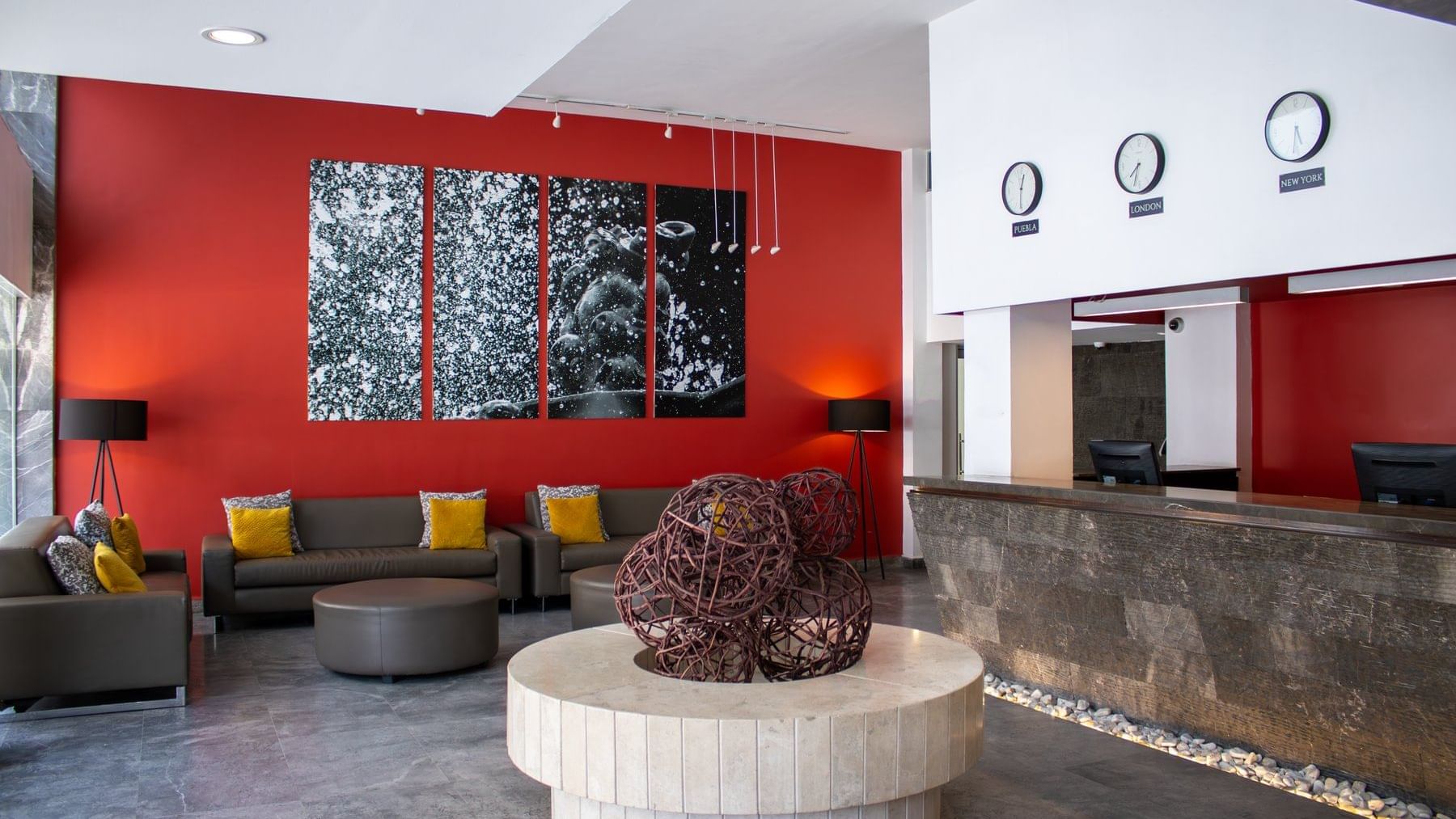 Hotel lobby with comfy seating & reception counter at Gamma Puebla Señorial Centro
