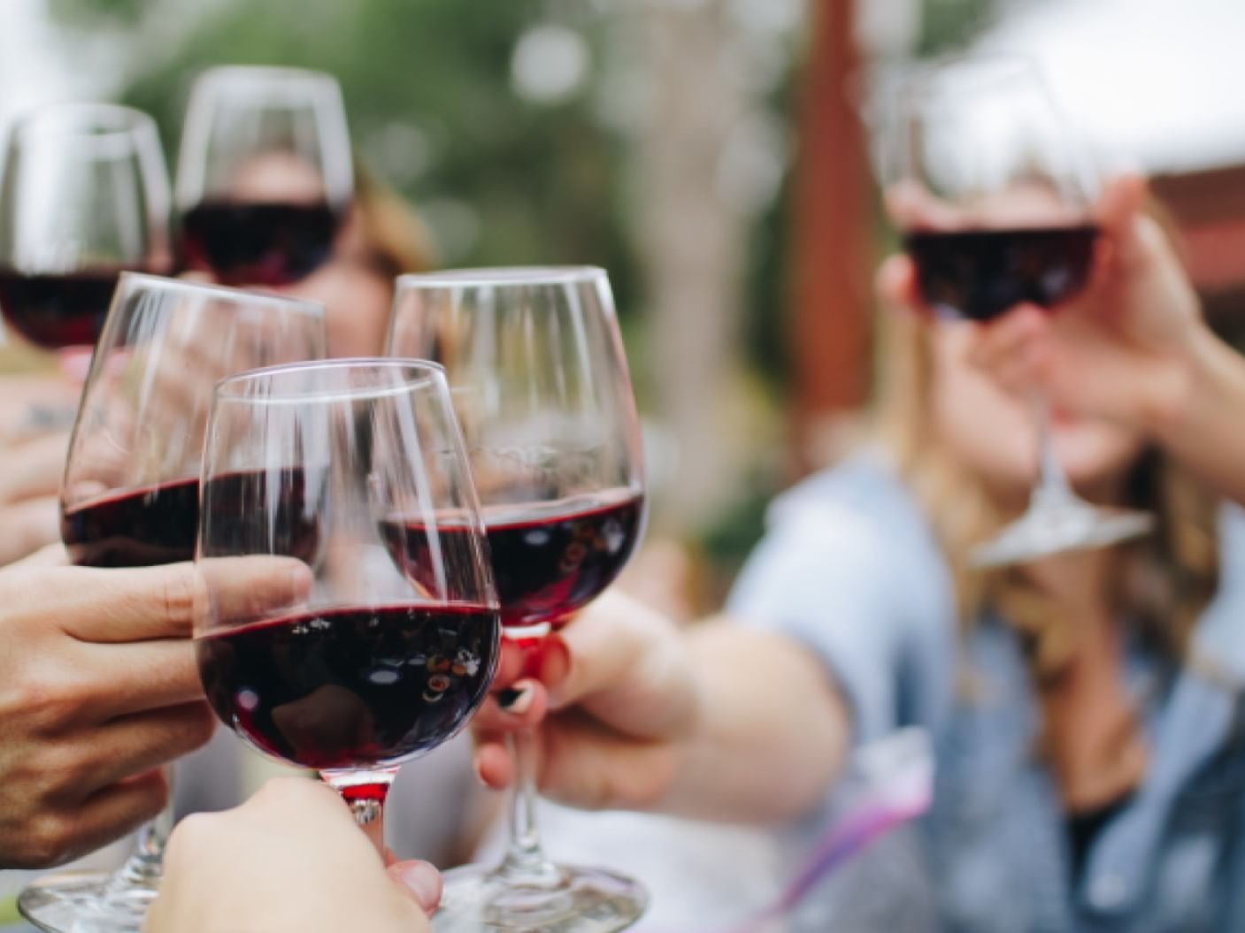 Close-up of People toasting wine at La Galerie Hotel