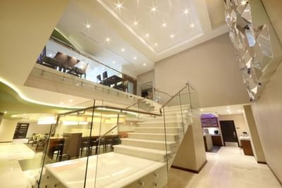 LED starlit ceiling ,glass staircase, and two-level living space at MARINN PLACE Financial District