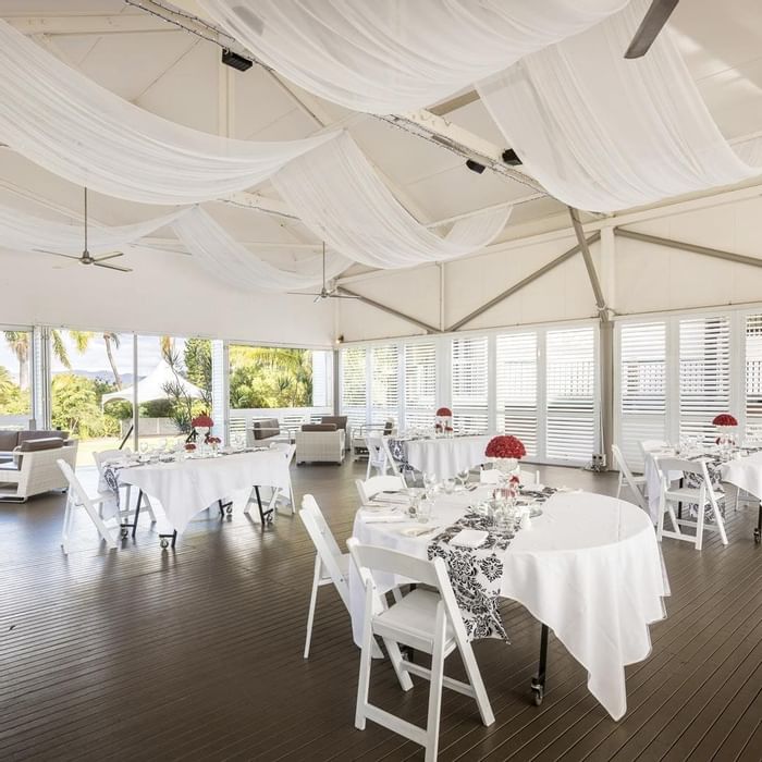 Plantation Deck featuring set tables, decorative centerpieces and flowing drapes at Mercure Hotel Townsville