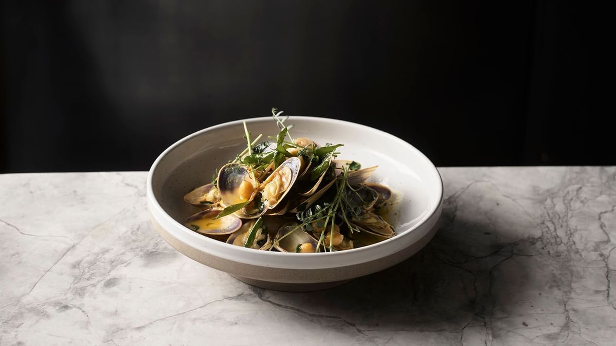 Oyster soup bowl in Woodcut restaurant at Crown Towers Sydney