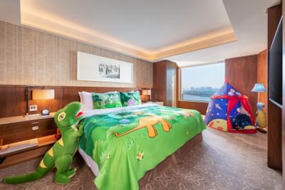 A kids tent & fluffy T rex in Family suite at White Swan Hotel