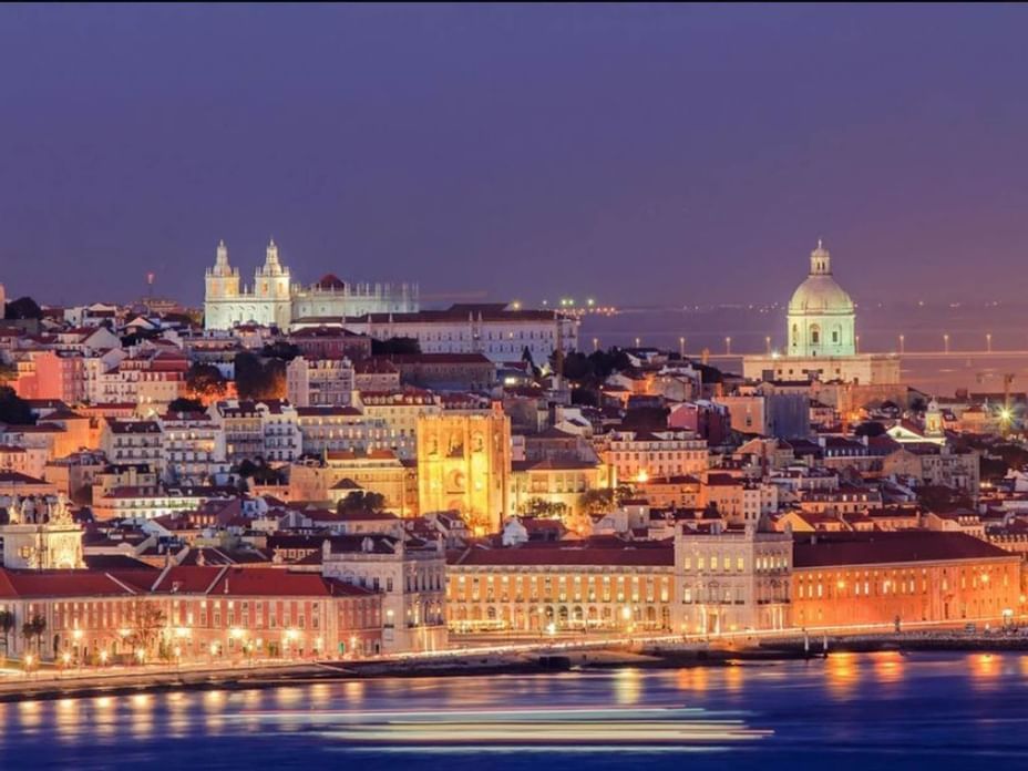 Aerial view of Lisbon city at night near Hotel Cascais Miragem