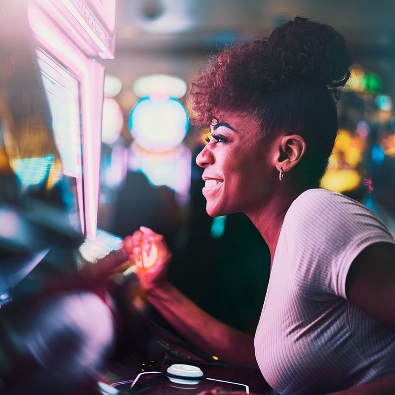 A lady playing games at Atlantics Casino near Warwick Paradise Island Bahamas