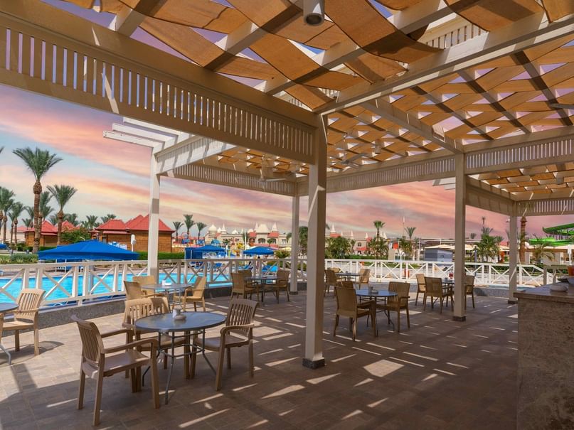 Lagoon Bar with outdoor seating and a pool view at Pickalbatros Aqua Blu Resort in South Sinai Governorate.