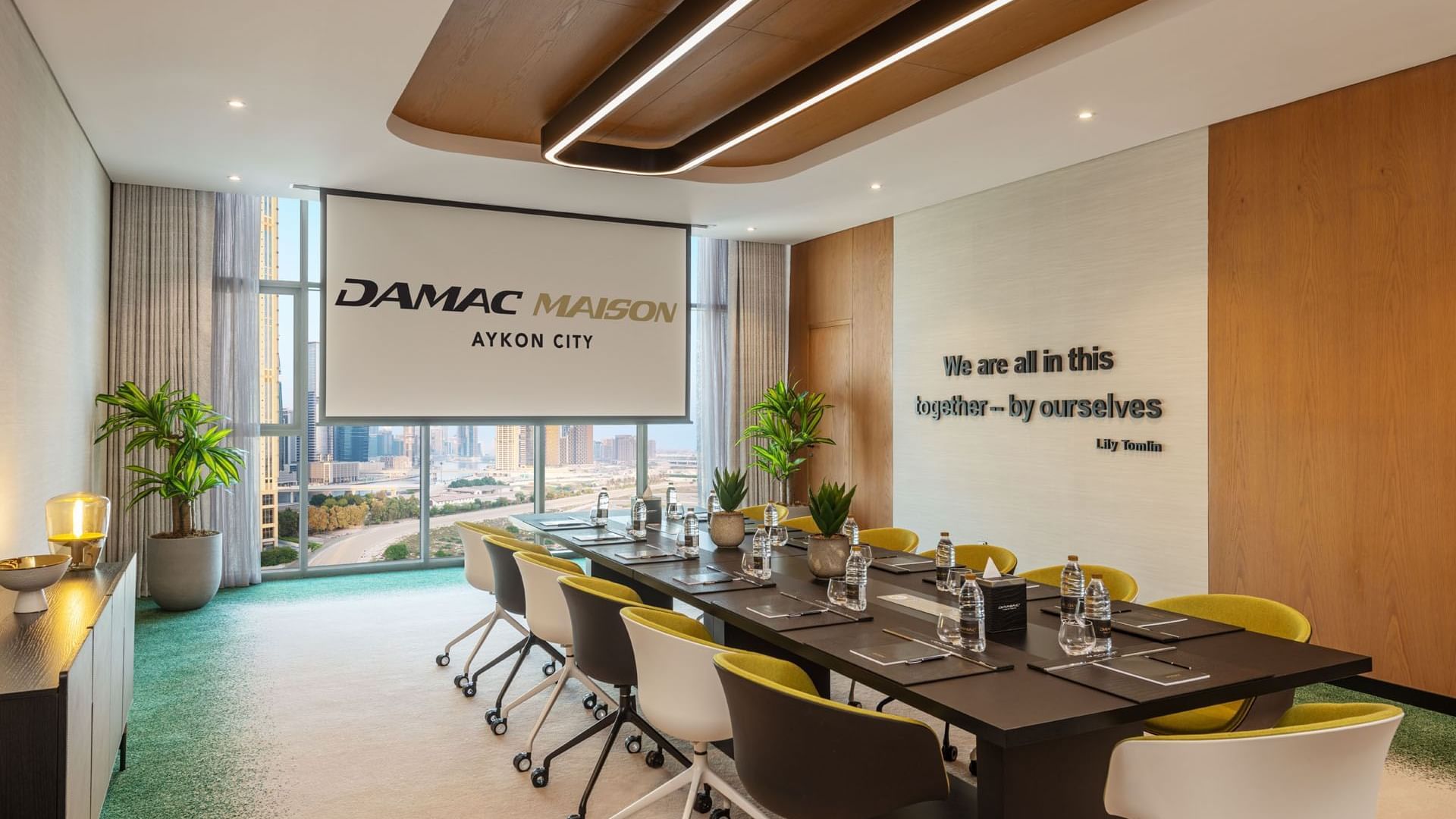 13-seater boardroom table with a city view in a Meeting Room at DAMAC Maison Aykon City Hotel Apartments