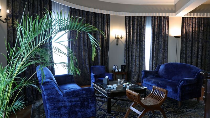 Executive Suite Living Room with blue seats & cozy interior at Warwick Palm Beach Hotel - Beirut