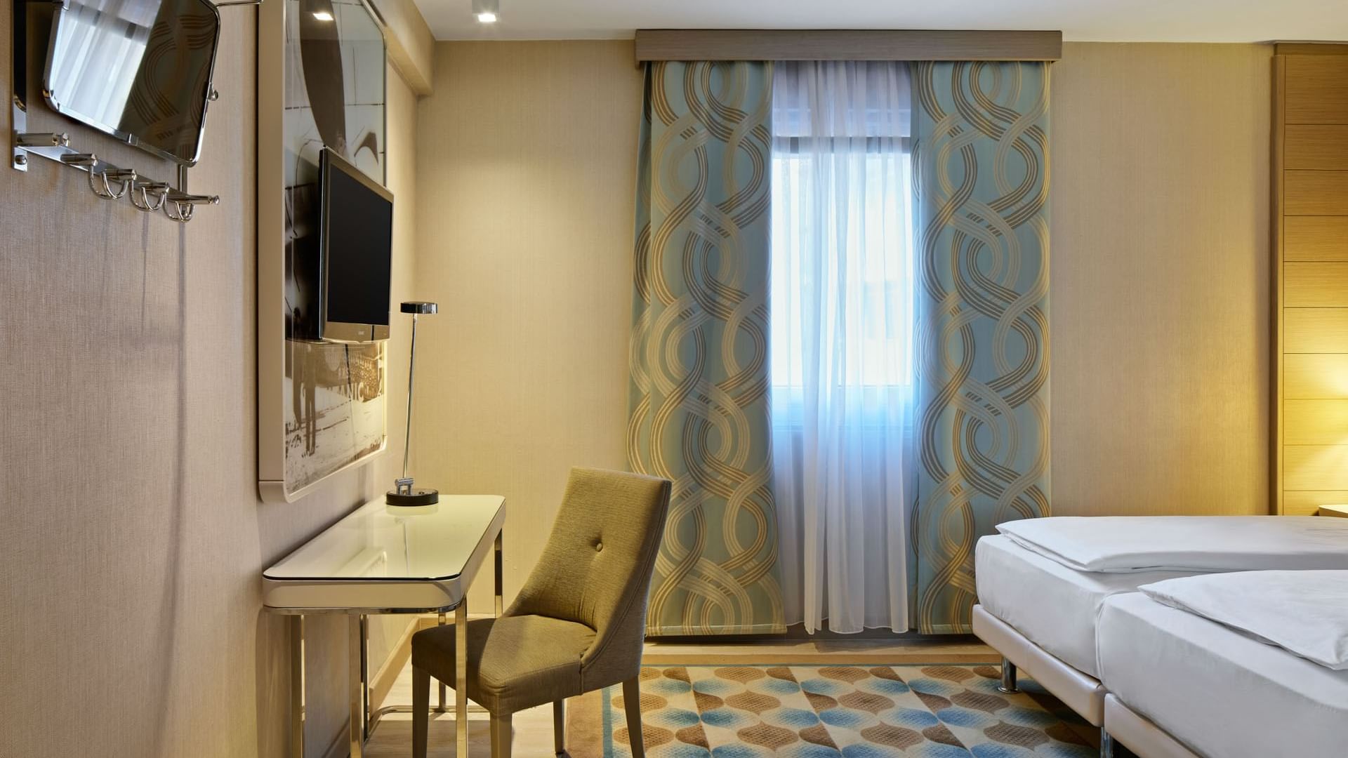 Separated bathroom and bedroom with work area in Superior Room at Titanic Comfort Mitte