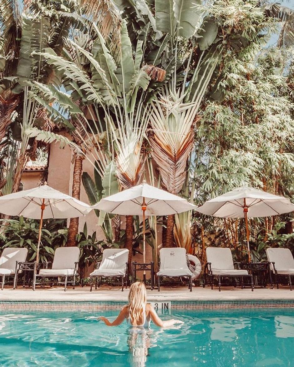 A girl in the outdoor pool at Brazilian Court