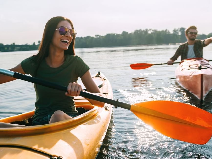couple rowing on lake