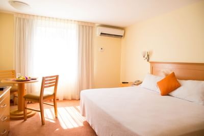 King bed, dining table in Superior Room at Araiza Hotel Palmira