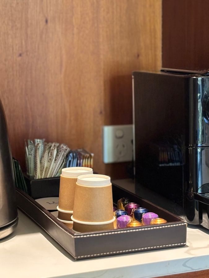 Electric kettle, coffee machine, and paper cups in Warwick Deluxe Rooms at Warwick Fiji Resort and Spa, Korolevu.