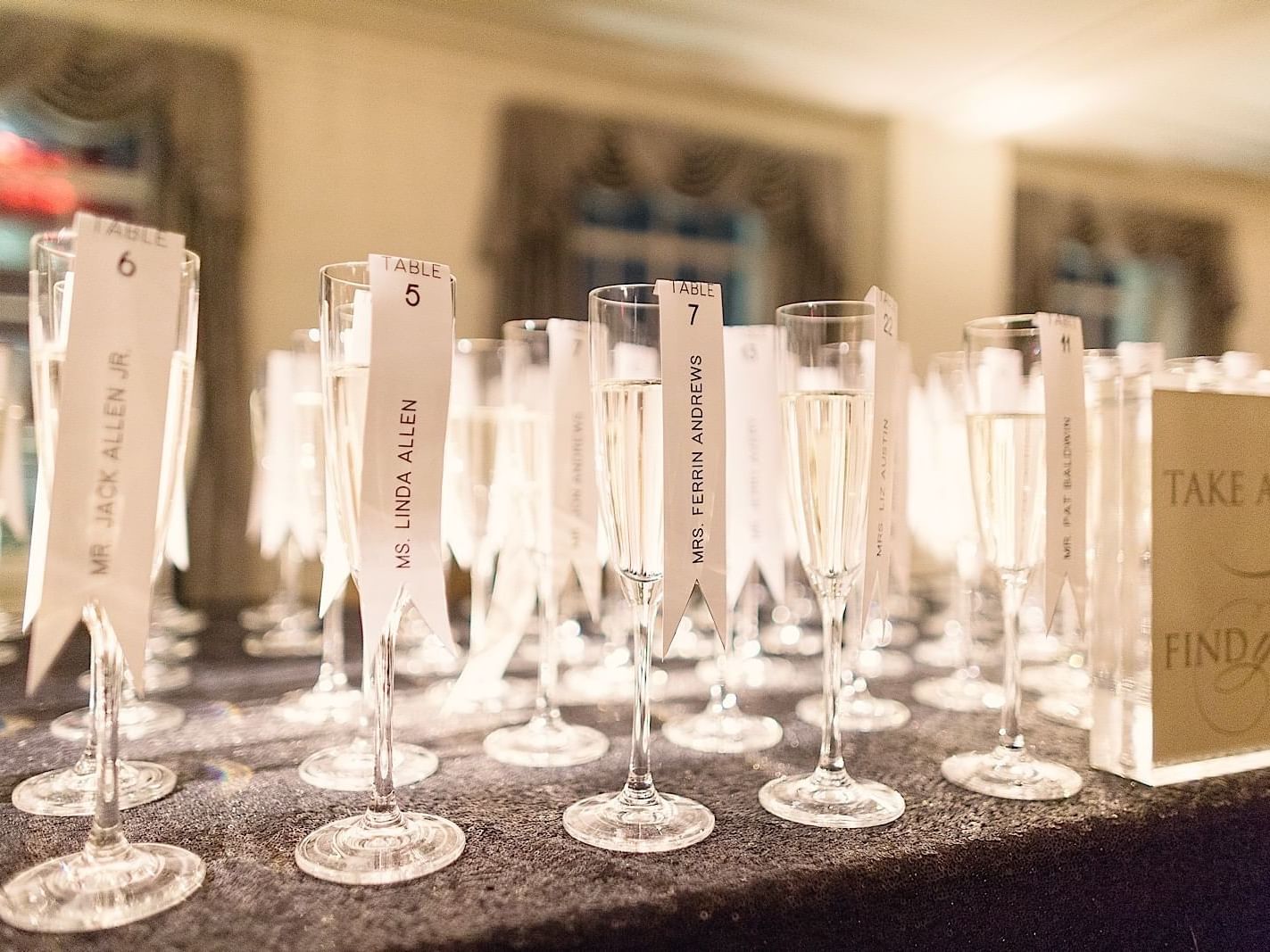 Close-up of empty glasses arranged on a table at The Mayo Hotel