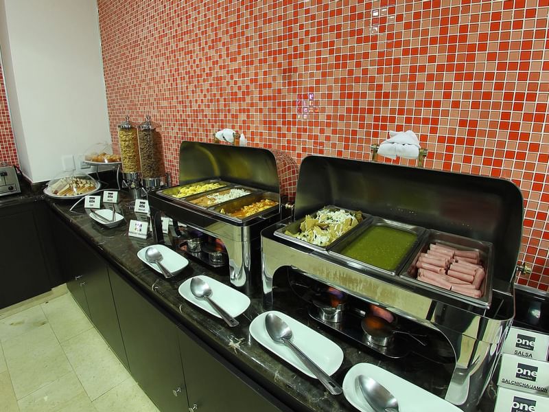 Close-up of a breakfast buffet display at One Hotels