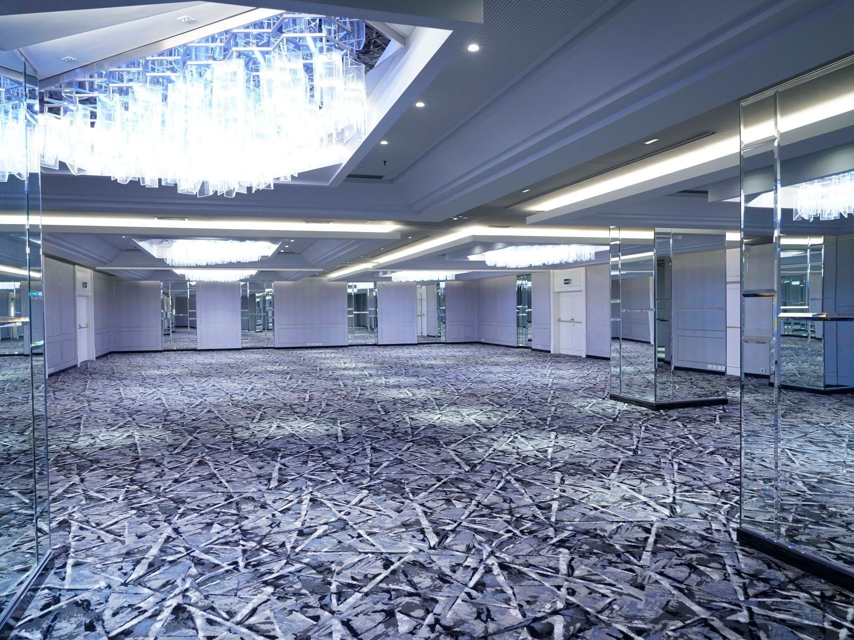 Del Prado event hall with a blue carpeted floor at Hotel Emperador Buenos Aires