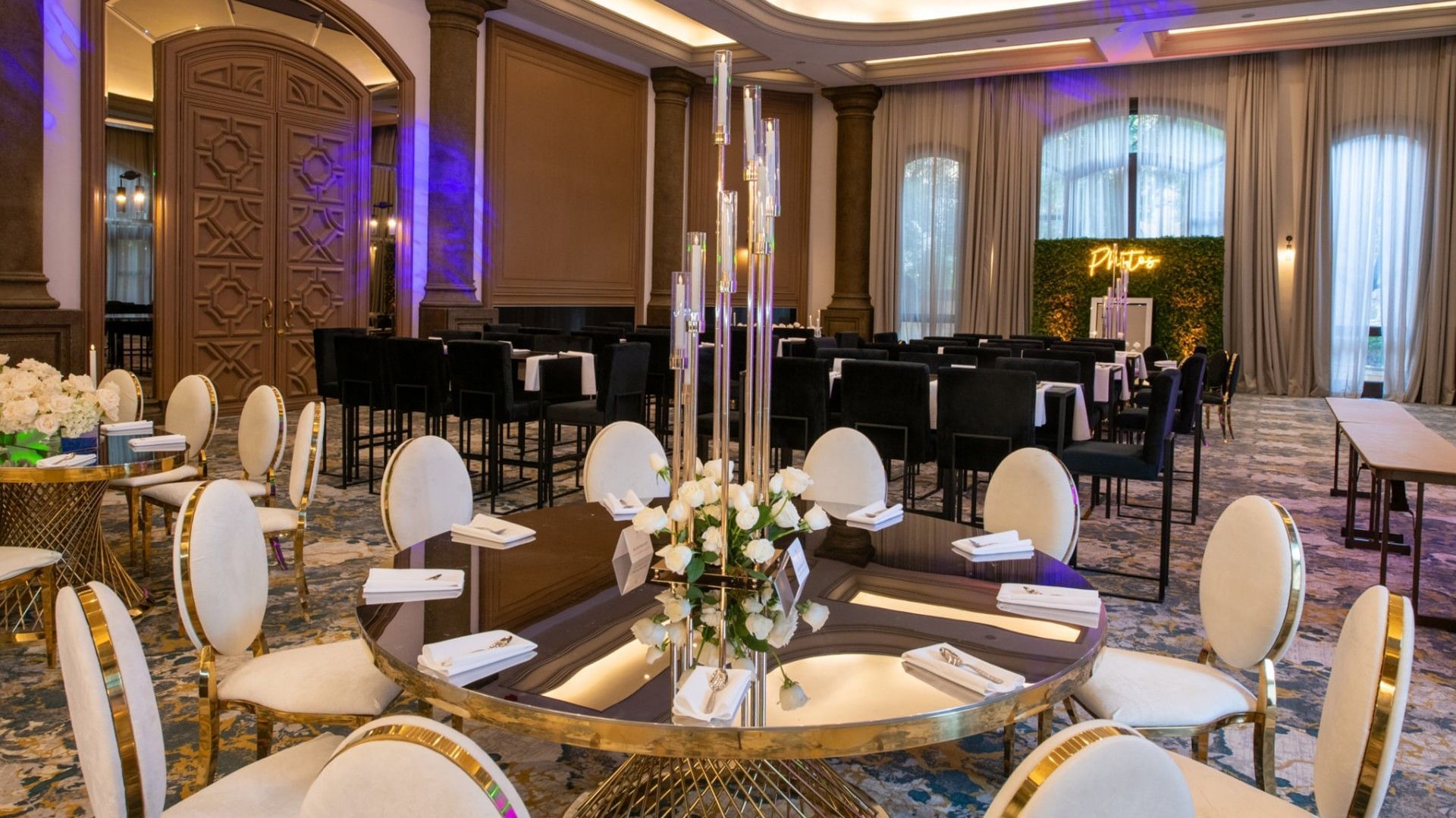 Gran Salon set for an event with gold-trimmed chairs and tall floral centerpieces at Quinta Real Monterrey