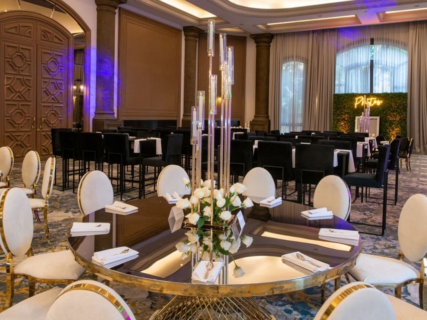 Gran Salon hall with gold-rimmed chairs, mirror tables, and tall candle centerpieces at Quinta Real Monterrey