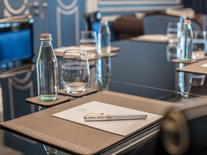 Drinking water, Pen & notepad on table at Palazzo Versace