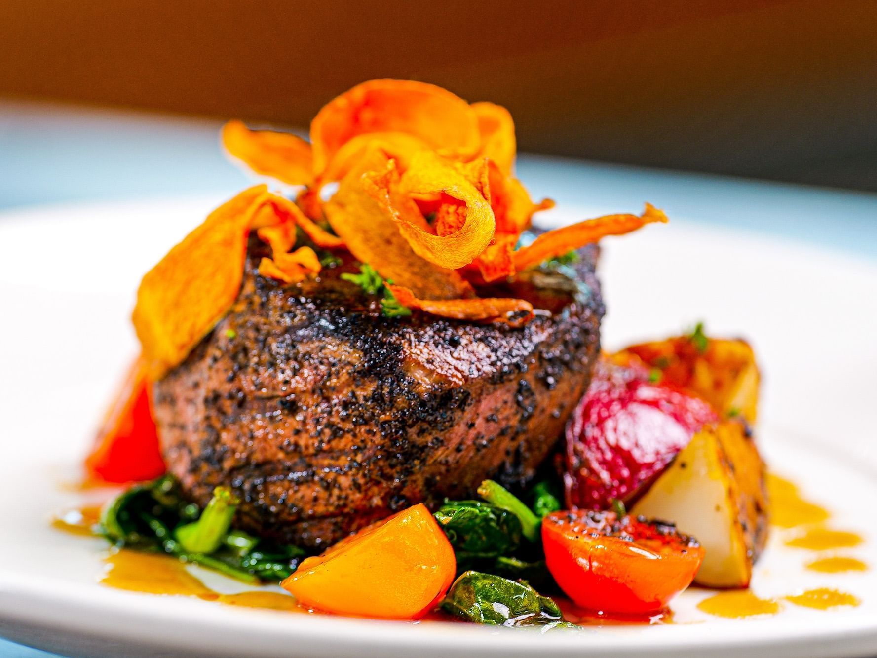 Steak served with colorful veggies at our Avalon NJ Restaurant 105 at ICONA Windrift