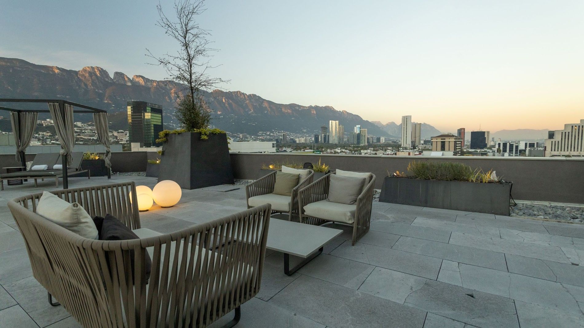 Terraza Vista Sierra terrace with modern lounge seating and a scenic mountain view at Camino Real Fashion Drive, Monterrey