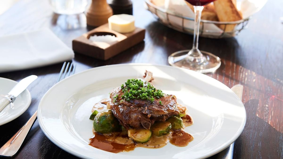 Gourmet meal of steak and Brussels sprouts served in Bistro Guillaume at Crown Hotel Melbourne