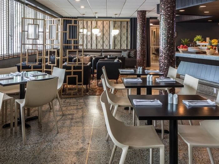 Dining area in Lapidus Restaurant at Capitol Skyline Hotel
