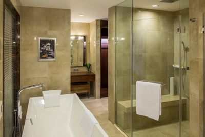 Bathroom with shower, tub & mirror in Club Executive Suite at Eastin Grand Hotel Saigon